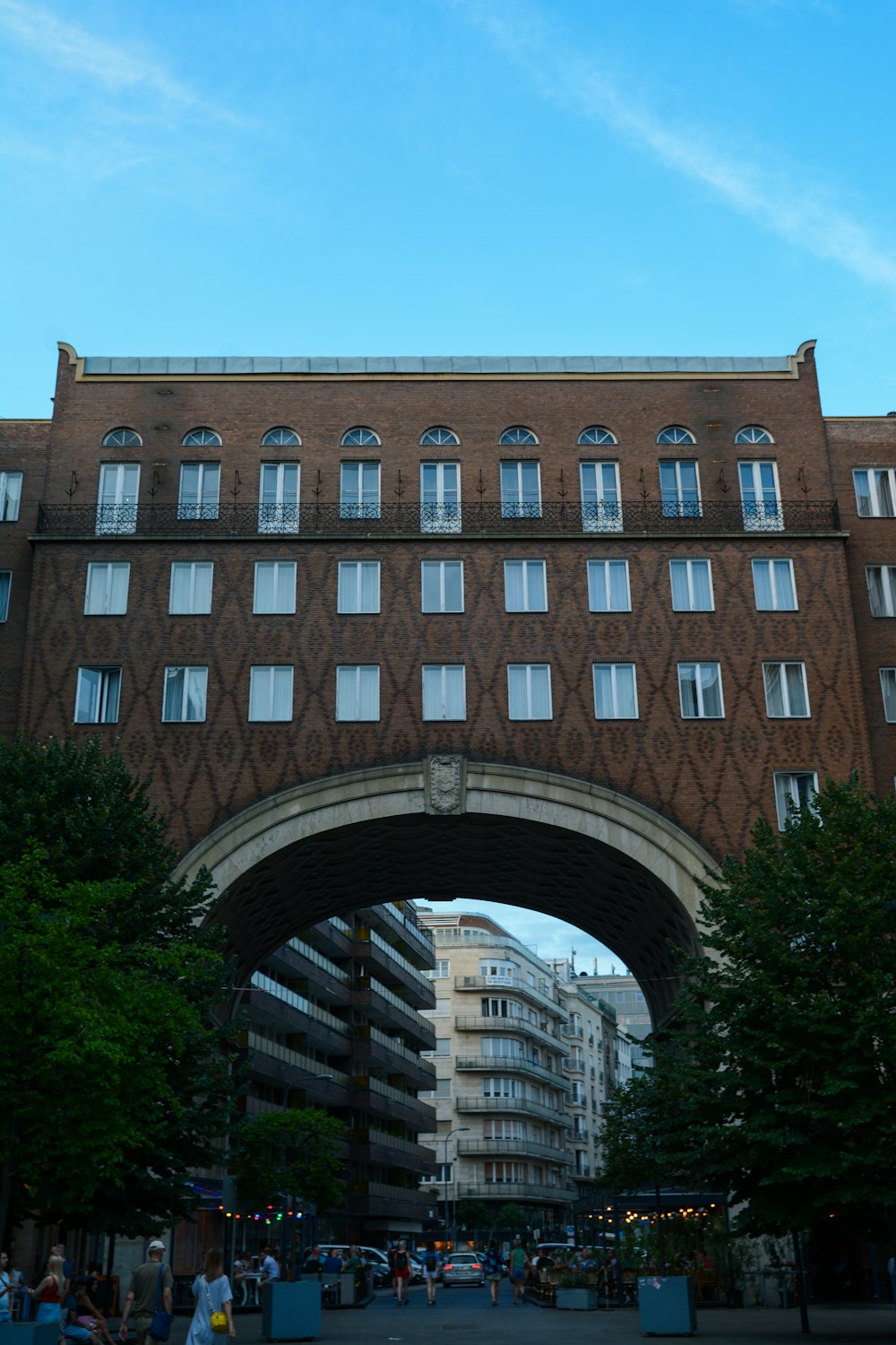 a large brick building with a bridge