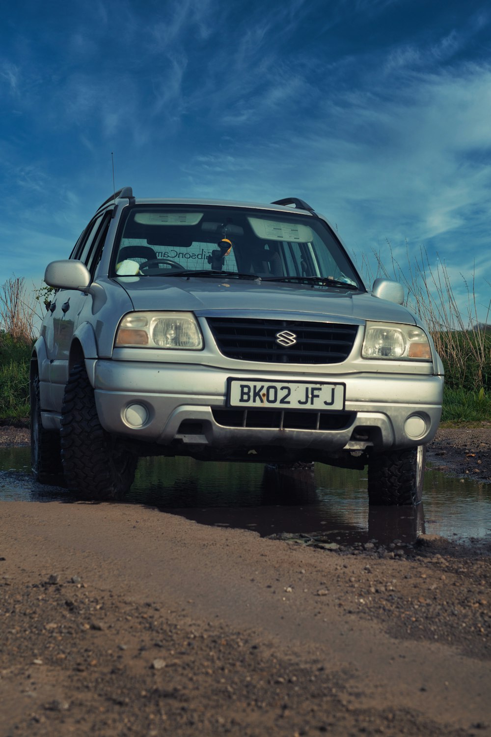 a car parked in a muddy area