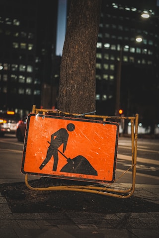 a sign on the sidewalk