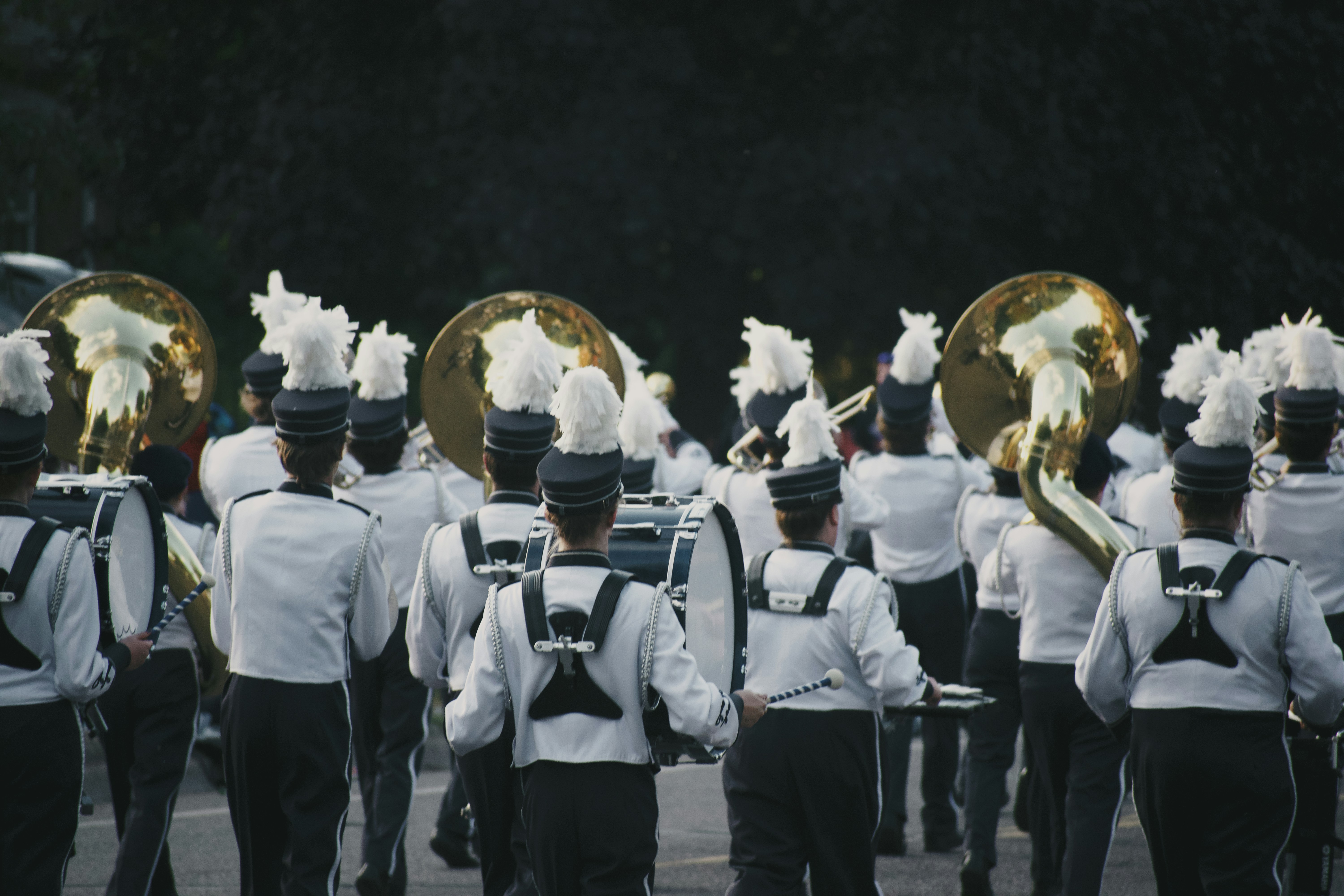 a group of people in uniform playing instruments