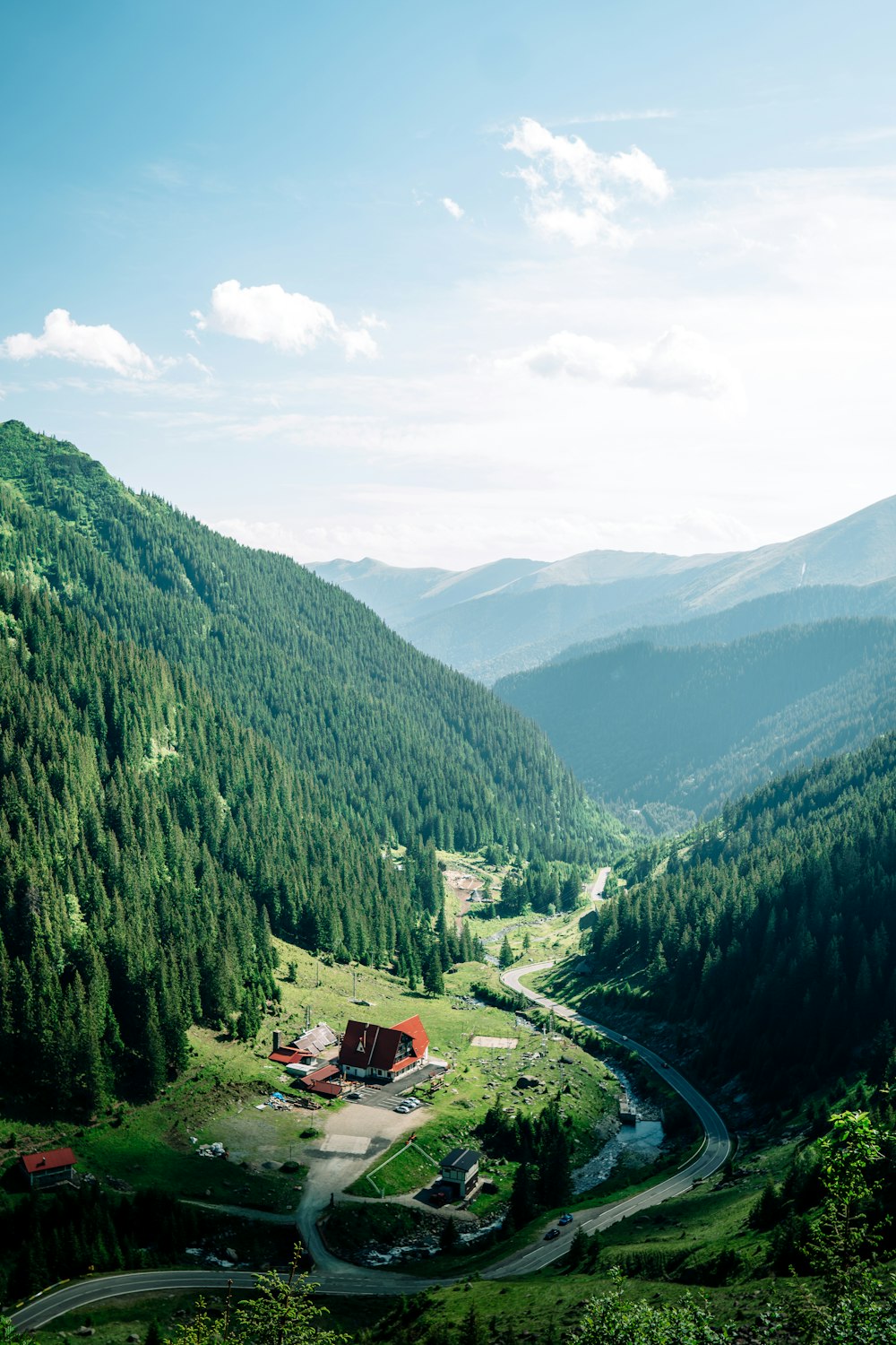 a winding road through a valley