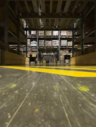 A neatly organized warehouse aisle filled with stacked boxes of electronic products ready for distribution.