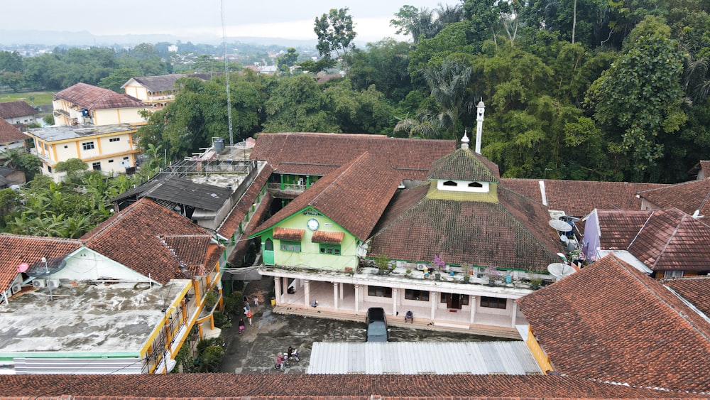 a group of buildings with trees in the back