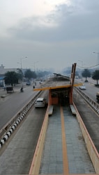 a road with cars and a bridge