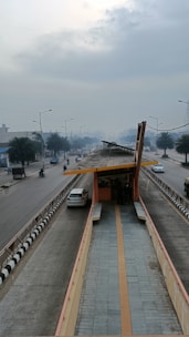a road with cars and a bridge