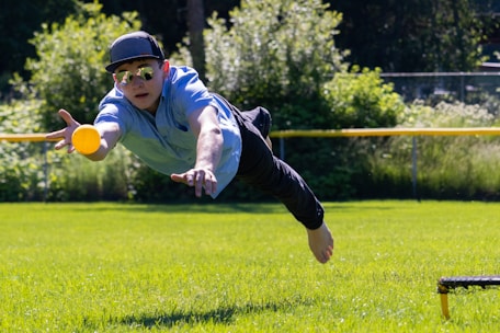 a man jumping to catch a ball