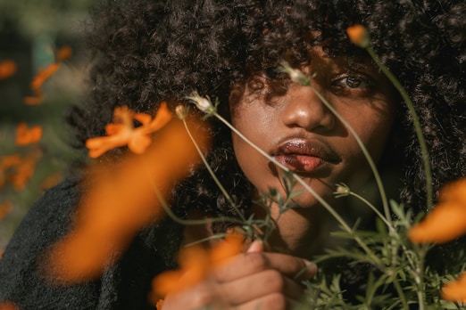 a man with a flower in his hair