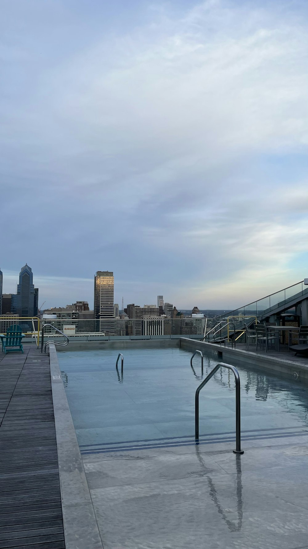 a body of water with a bridge and buildings in the background