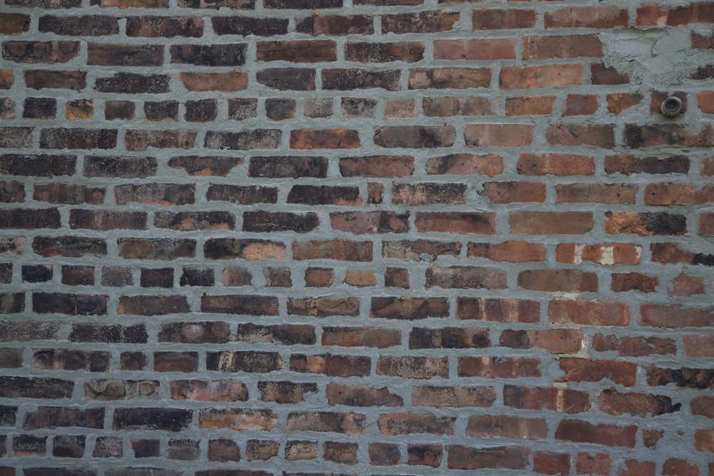 a brick wall with a hole in it