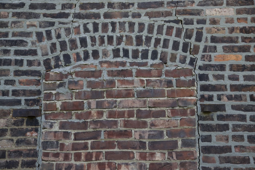 a brick wall with a hole in it