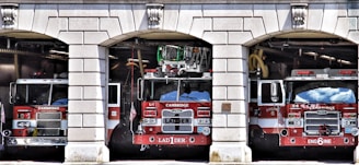 a group of fire trucks in a garage