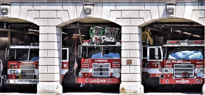 a group of fire trucks in a garage