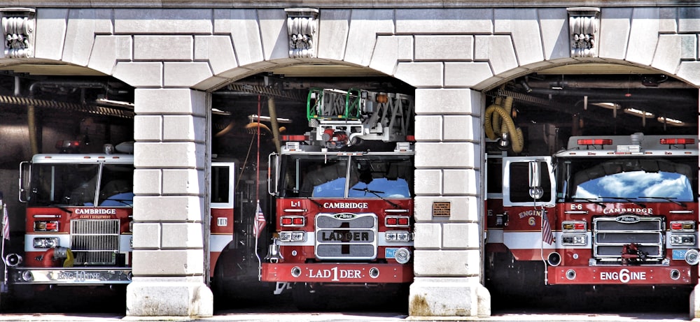 a group of fire trucks in a garage