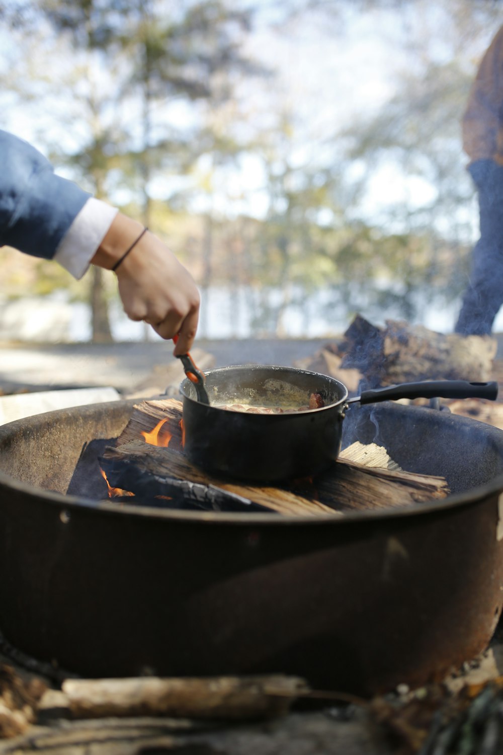 a person cooking food on a grill