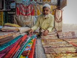 a man sitting on a bed