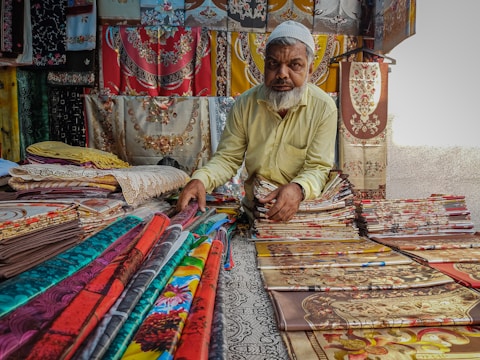 a man sitting on a bed