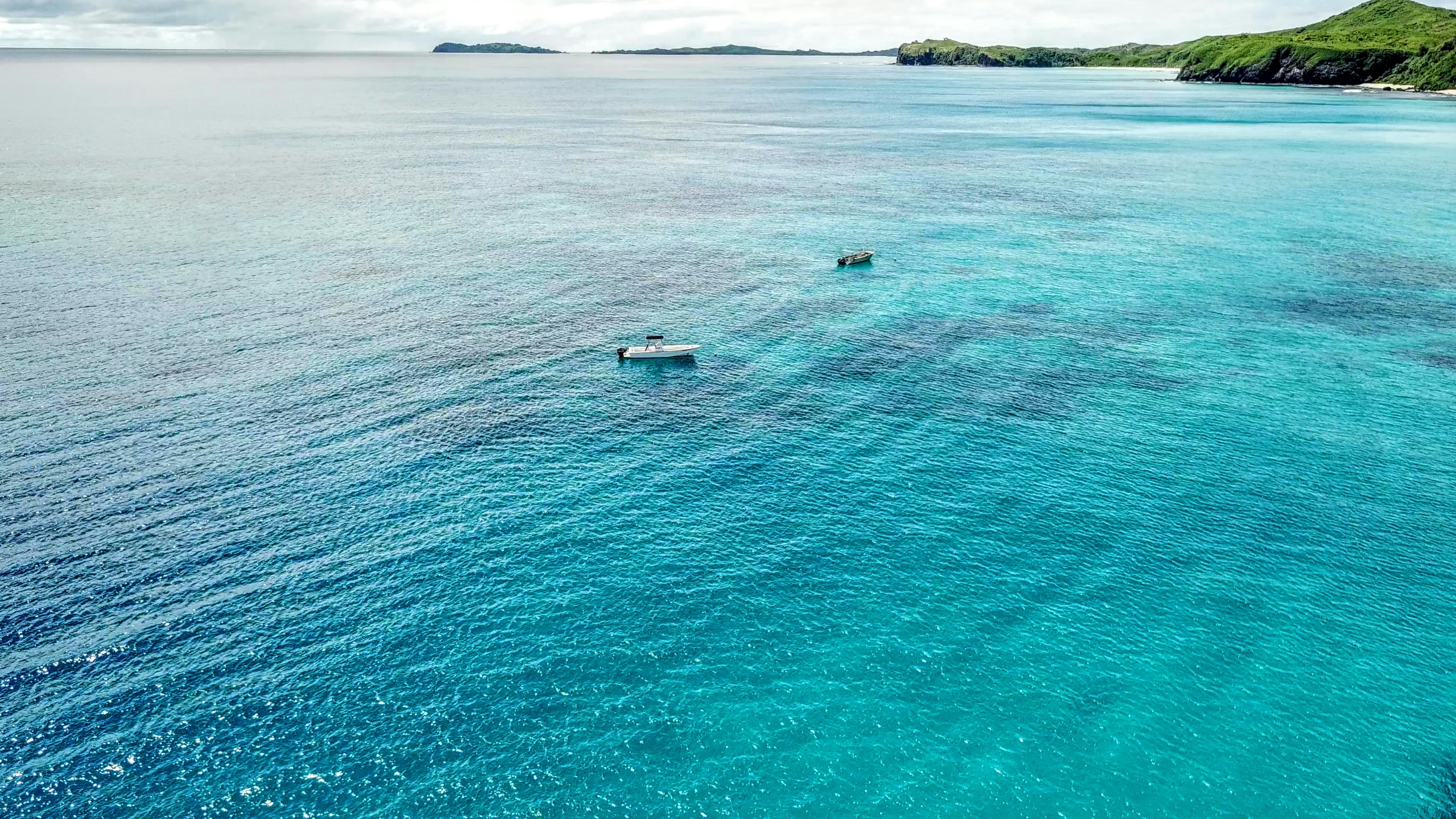 a group of boats in a body of water, 