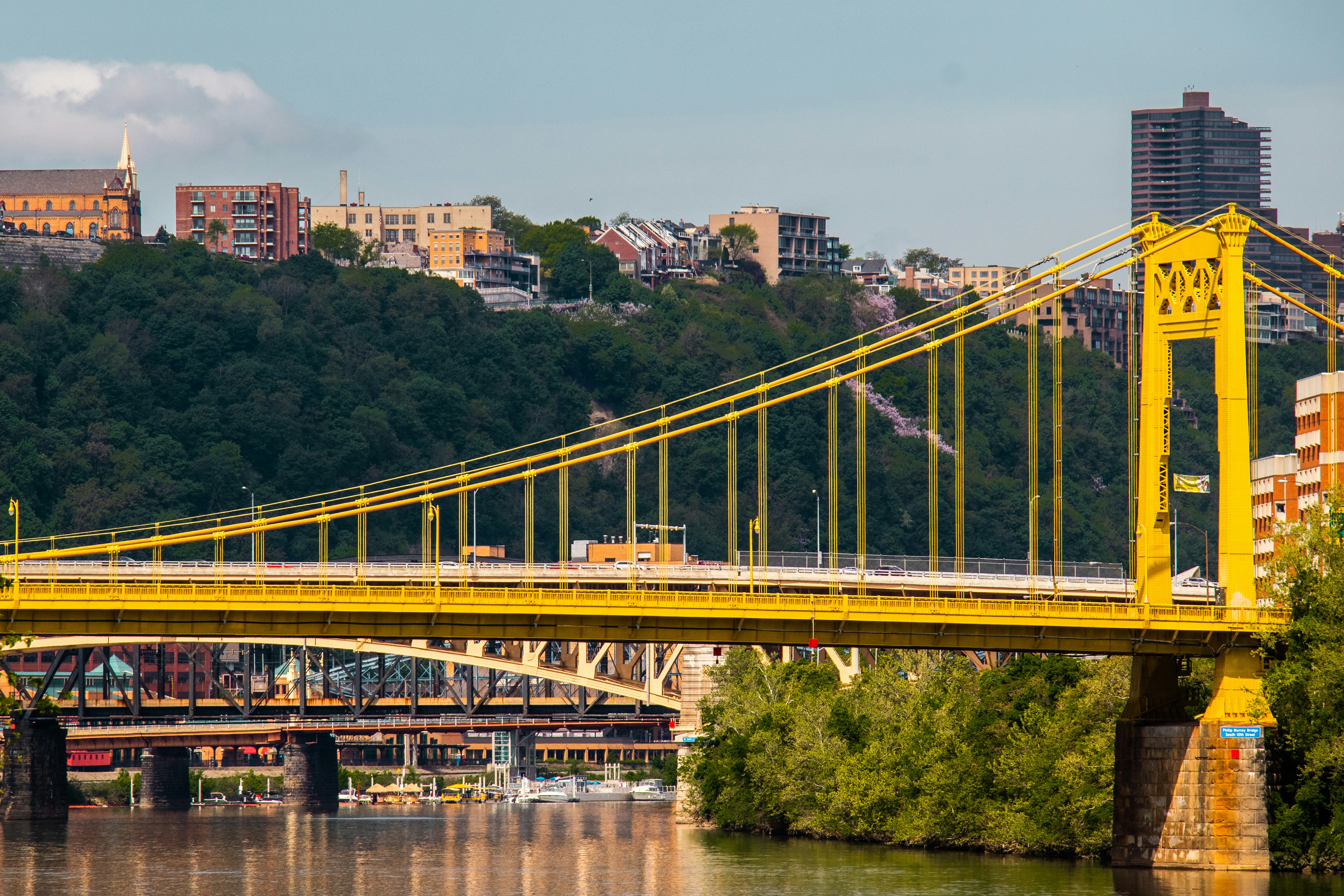 a train on a bridge over a river