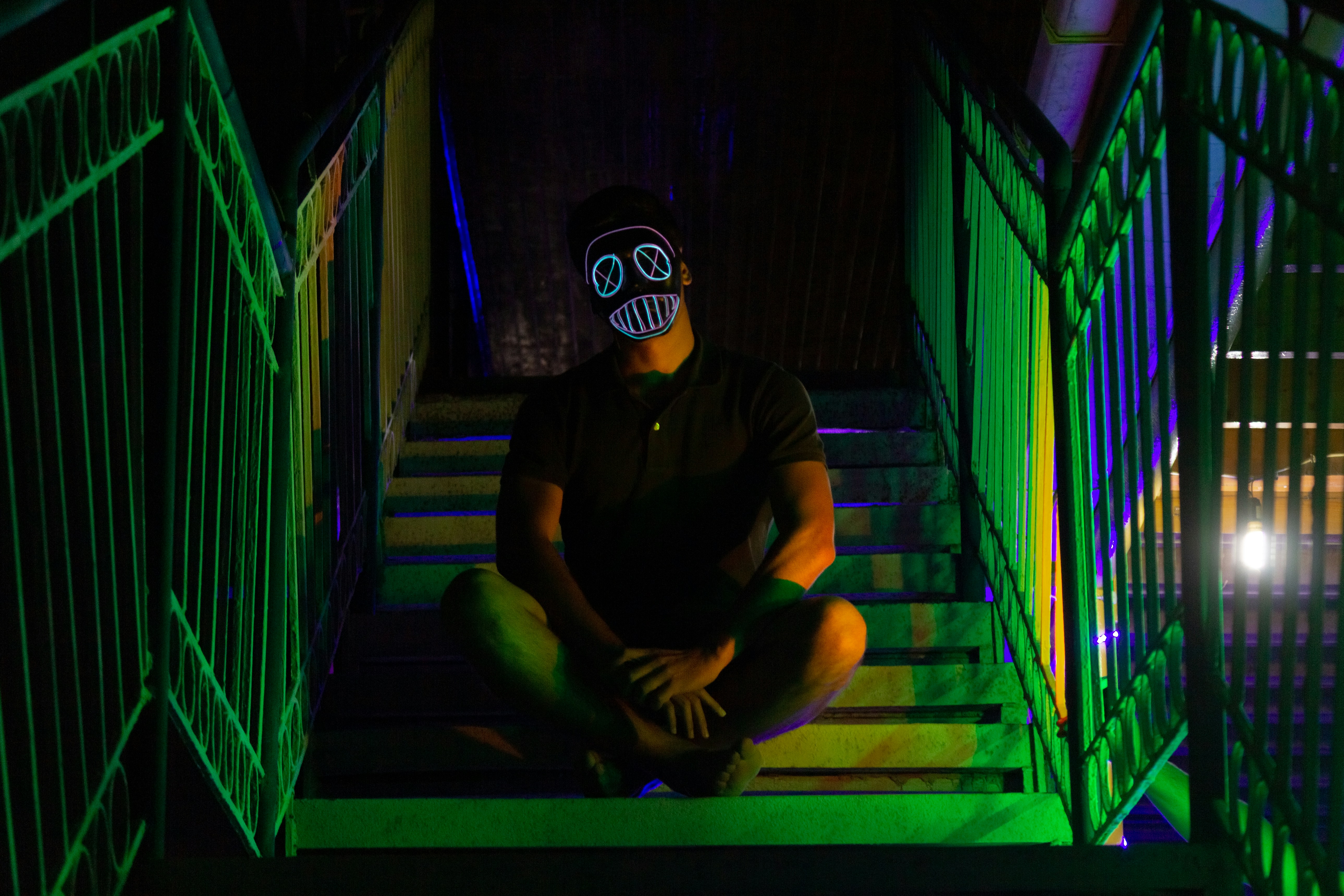 Artist portrait in moody neon studio lighting