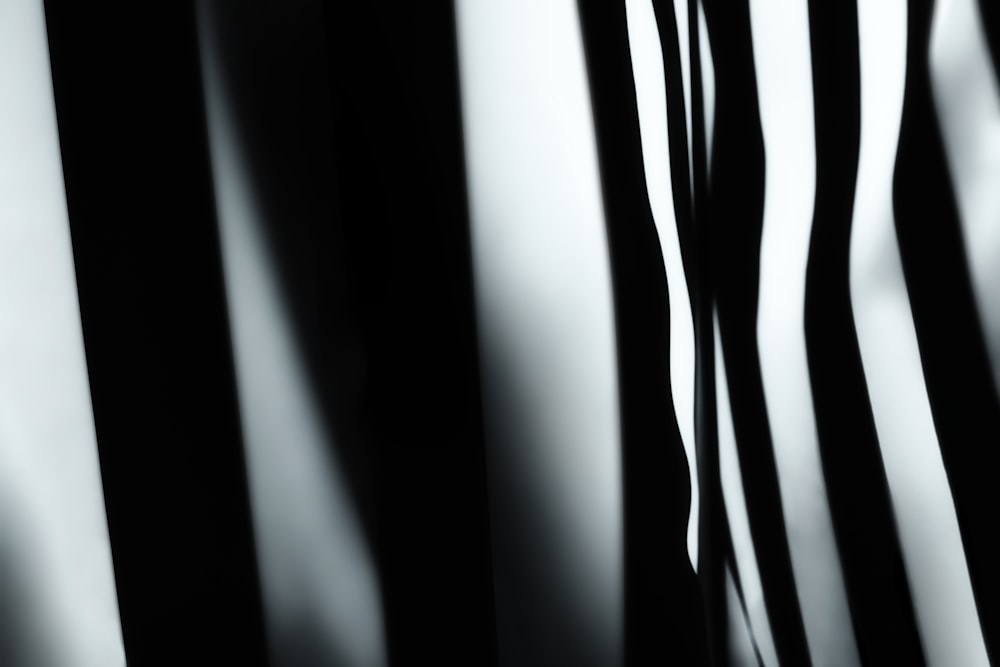 a close up of a black and white striped wall