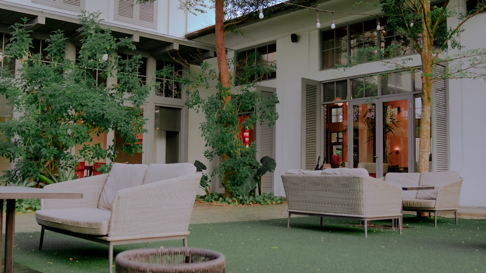 a patio with chairs and a table