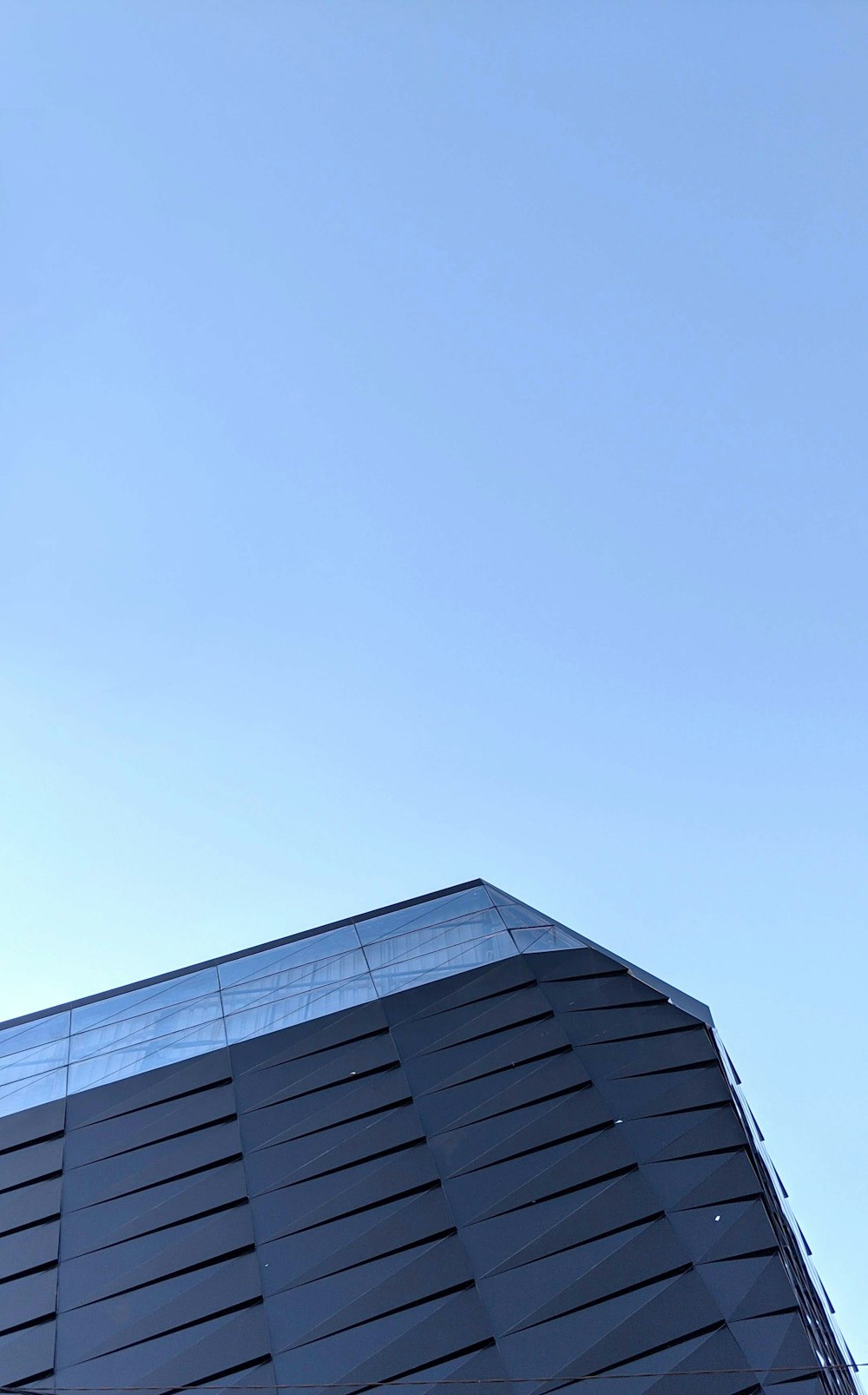 a tall building with a blue sky