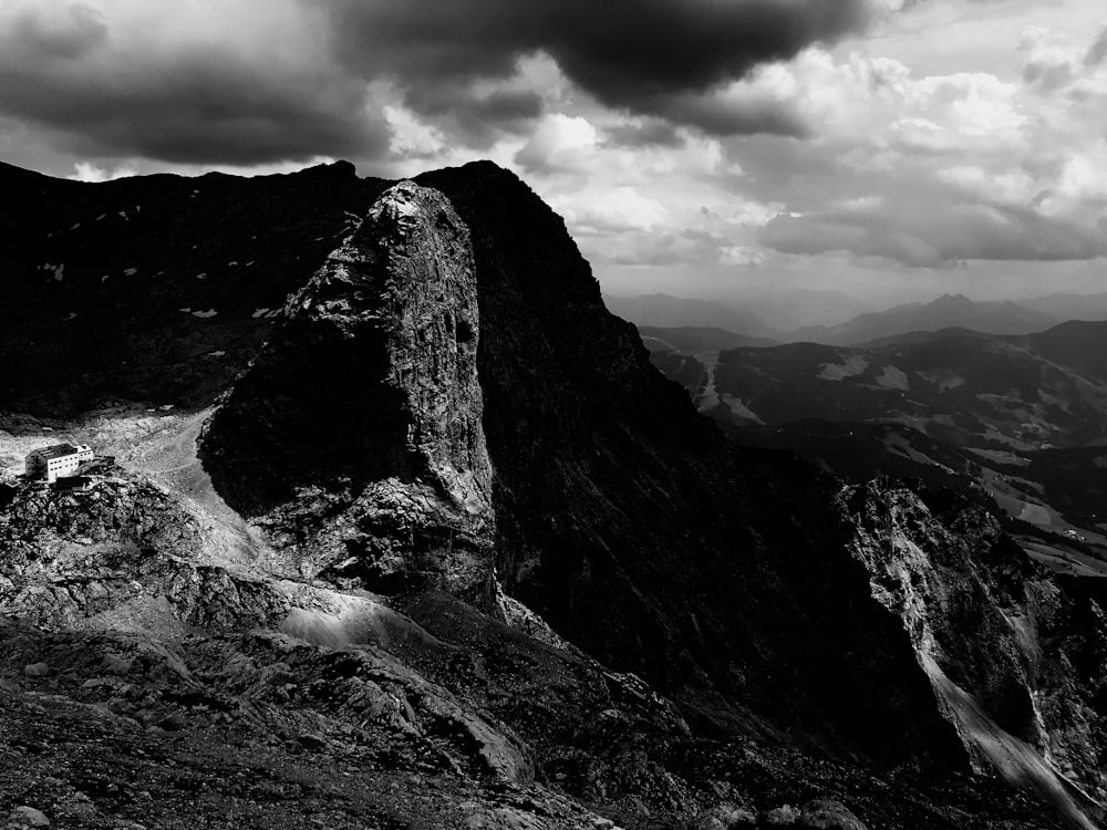 a rocky mountain with a river running through it