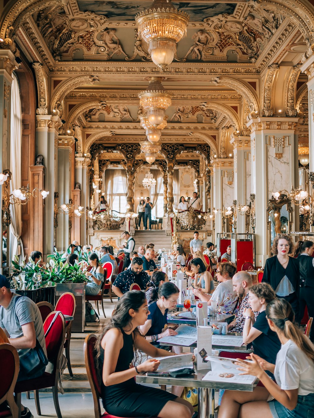 a group of people sitting at tables