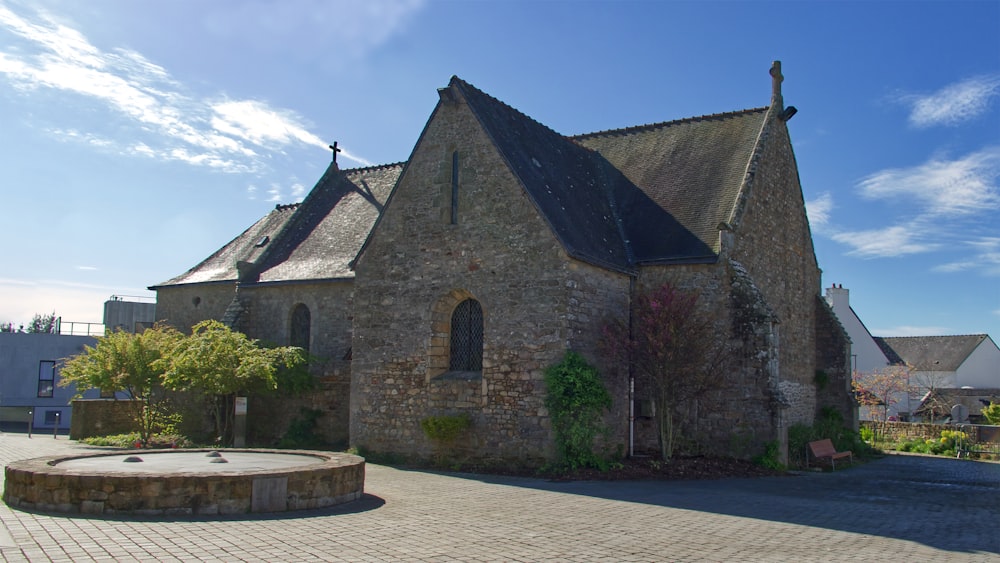 a stone church with a stone courtyard