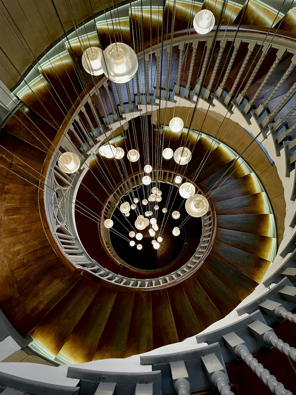 a spiral staircase with many lights