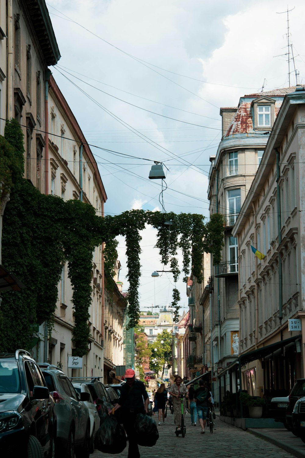 a street with cars and people