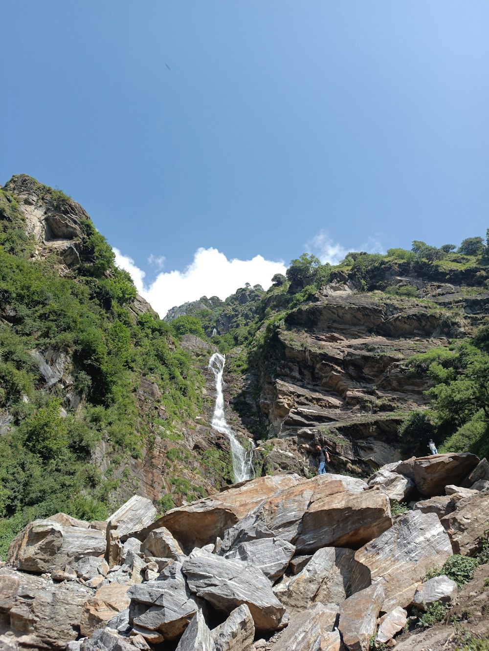 a rocky area with a waterfall