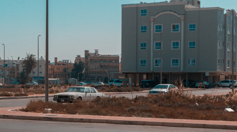 a parking lot with cars and buildings