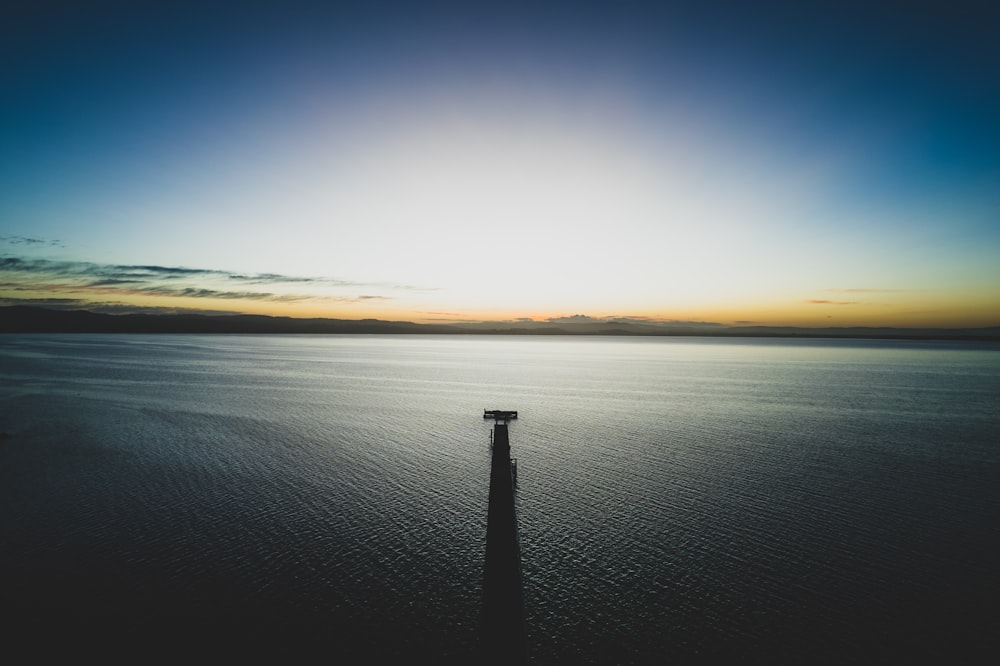 a body of water with a dock in it