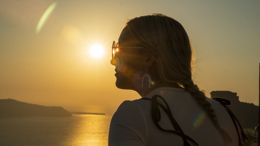 a person looking at the sunset