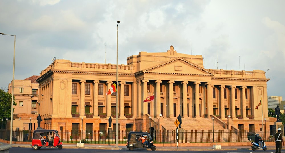 a building with flags on the roof