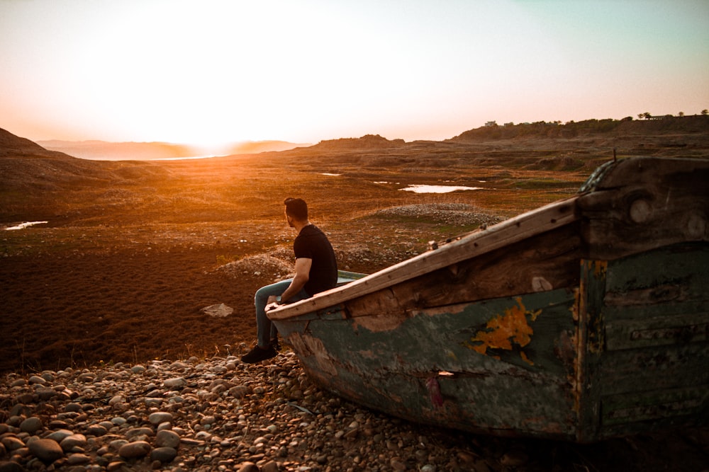 a man sitting on a boat