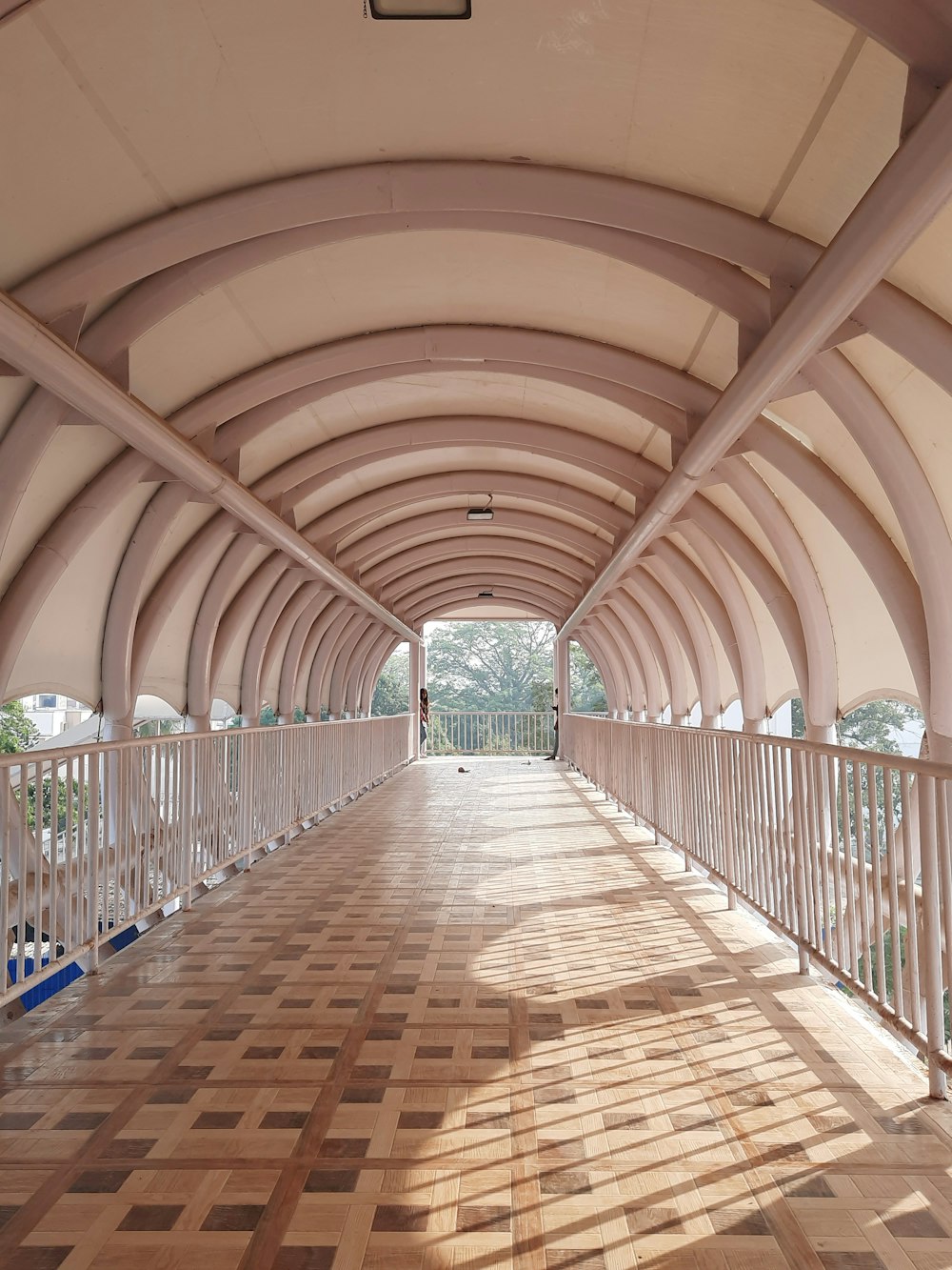 a wooden walkway with a railing