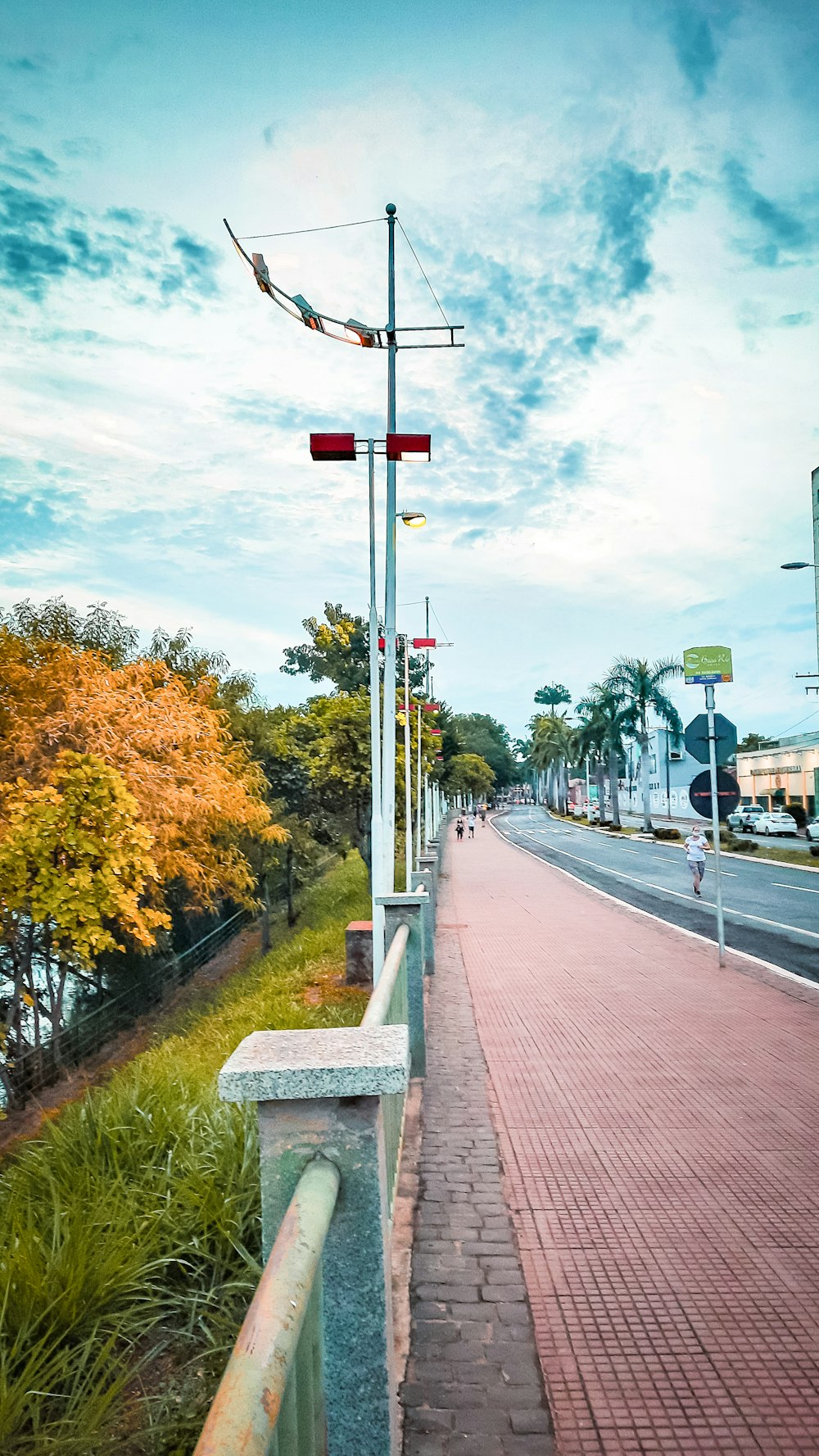 a sidewalk with a red light