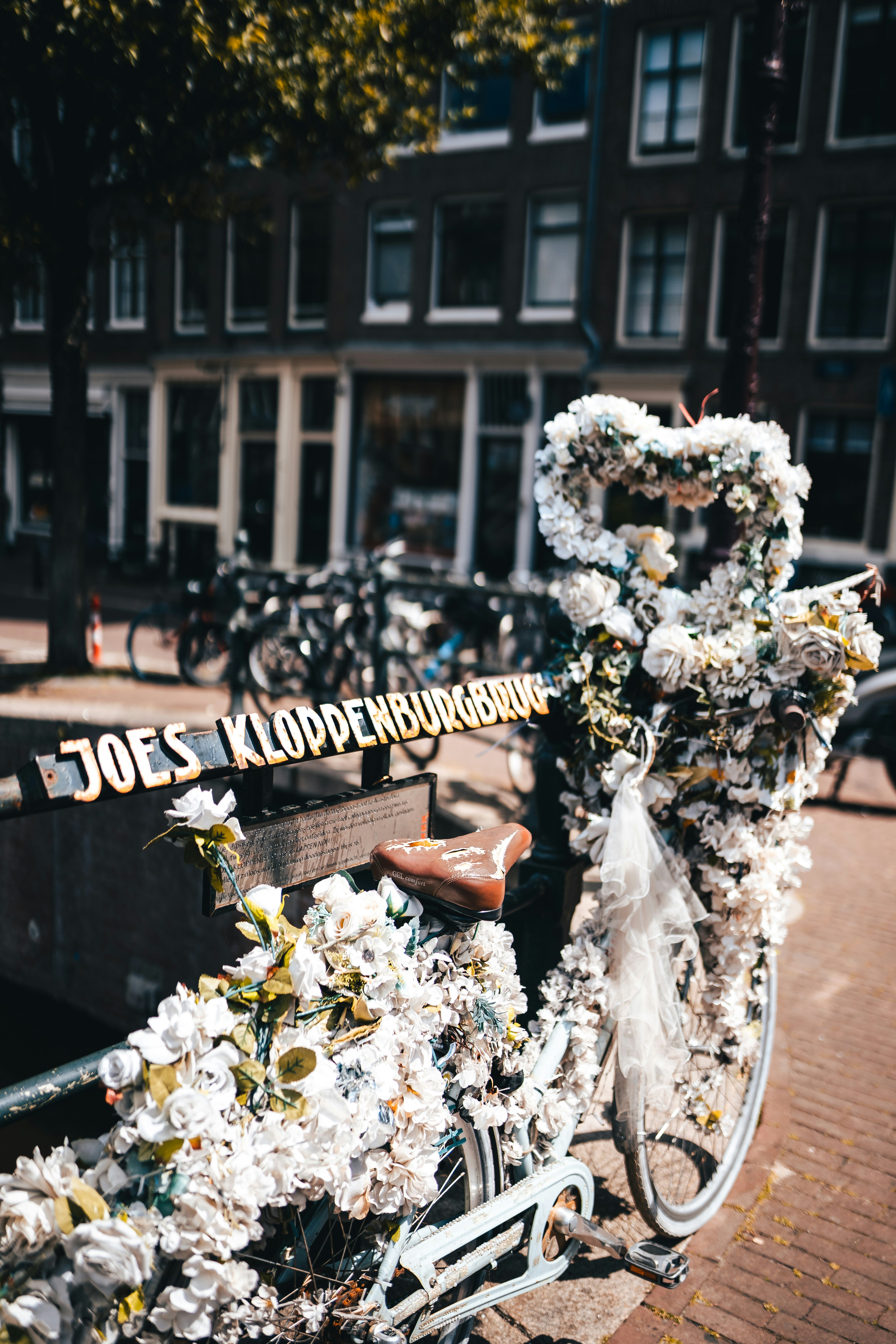 a bicycle parked next to a bench