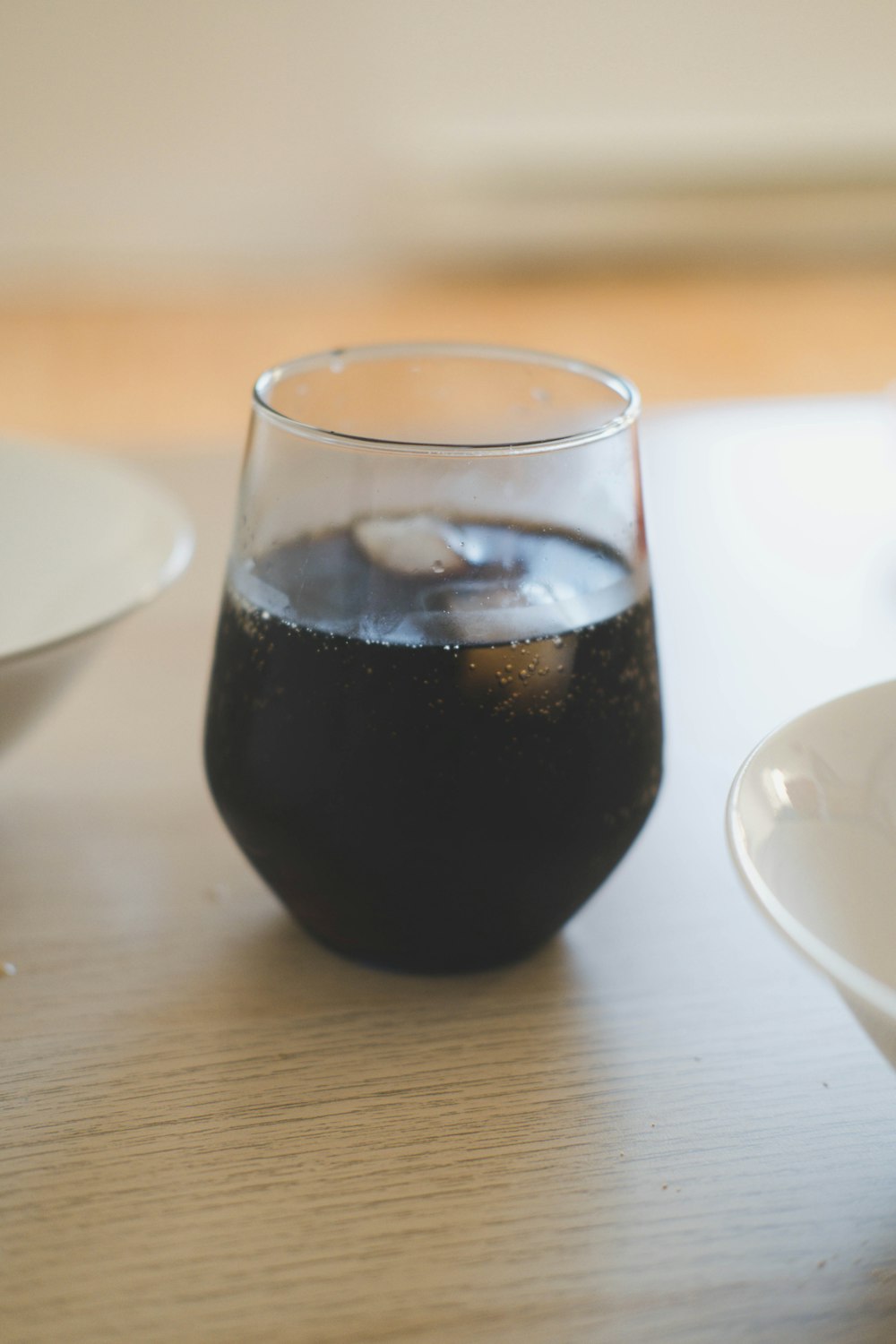 a glass of dark liquid