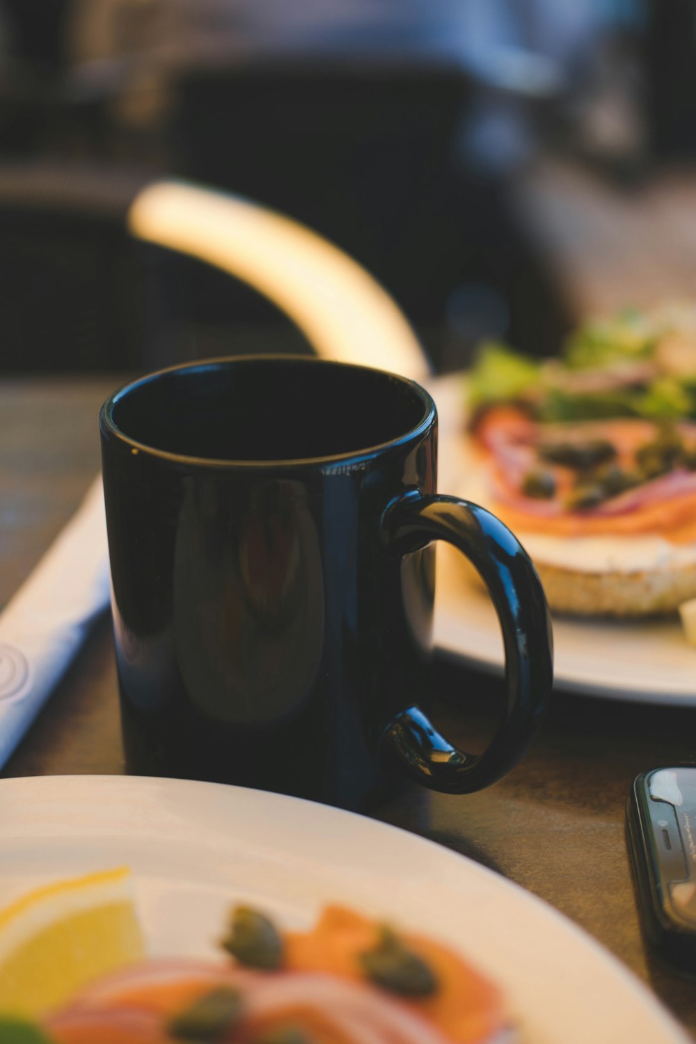 a black coffee cup on a table