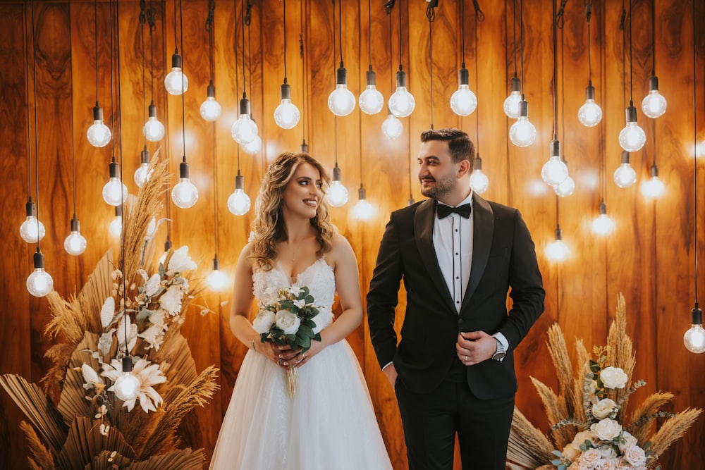 a man and woman in wedding attire