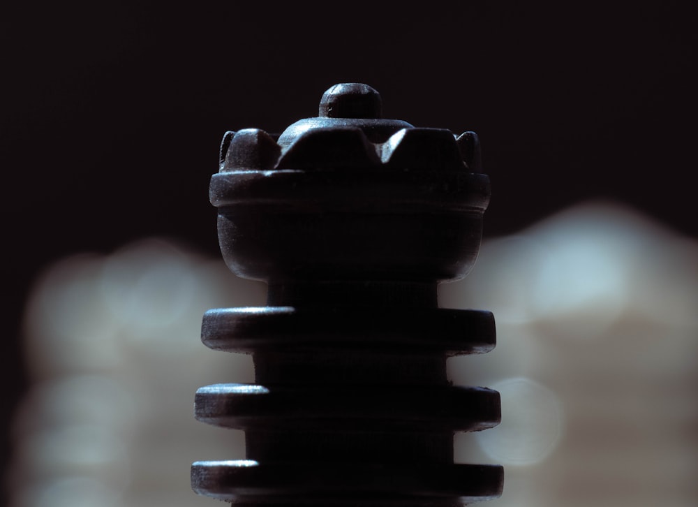 a stack of black cylindrical objects