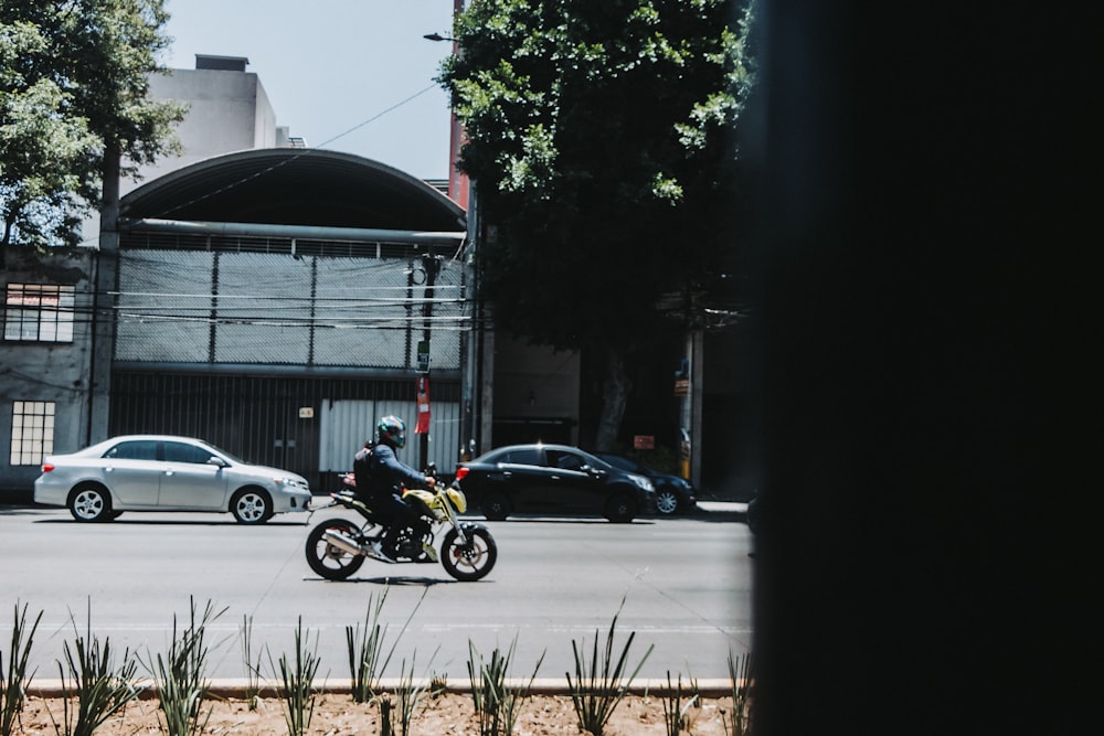 a person on a motorcycle in the street