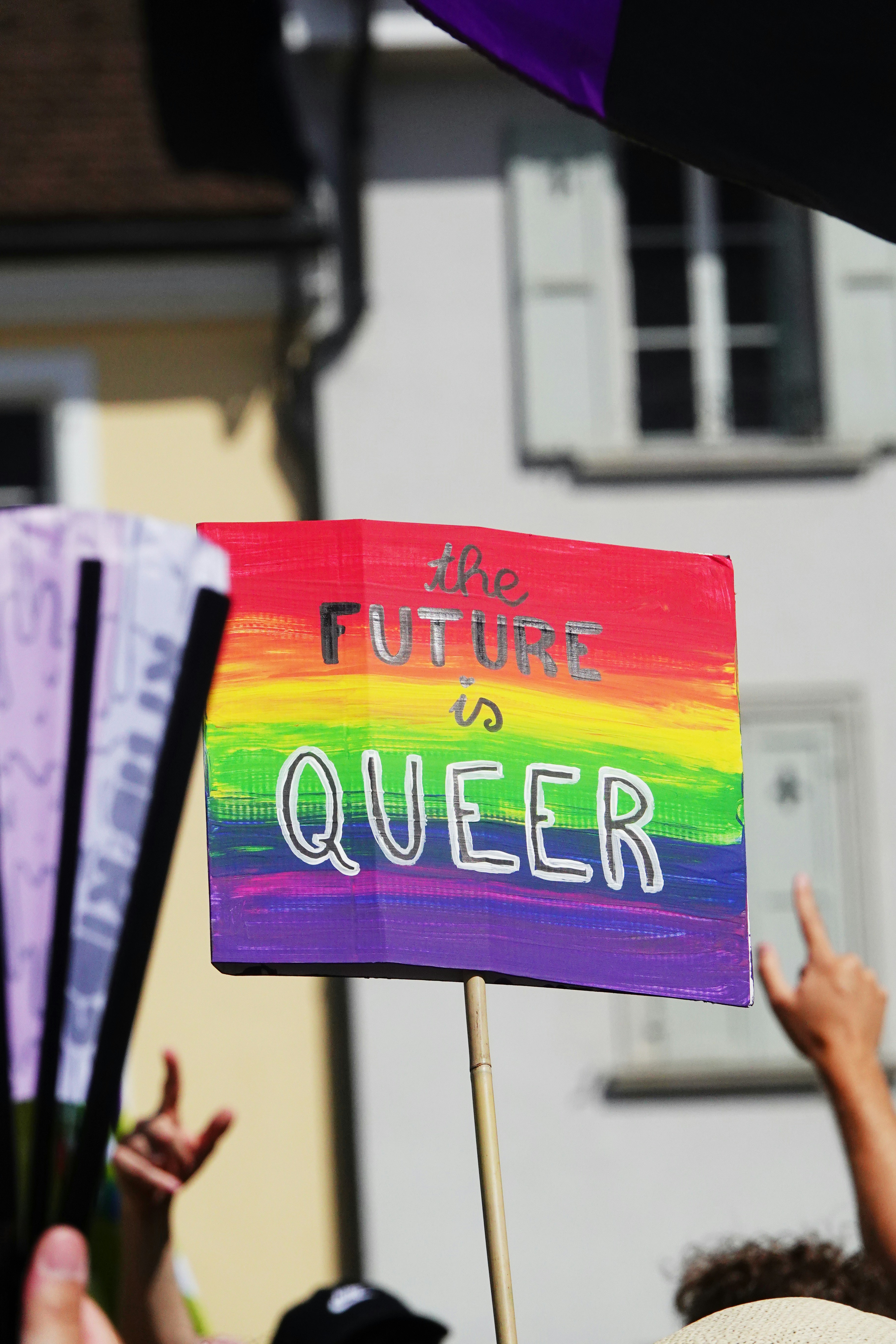 a group of people holding up a sign