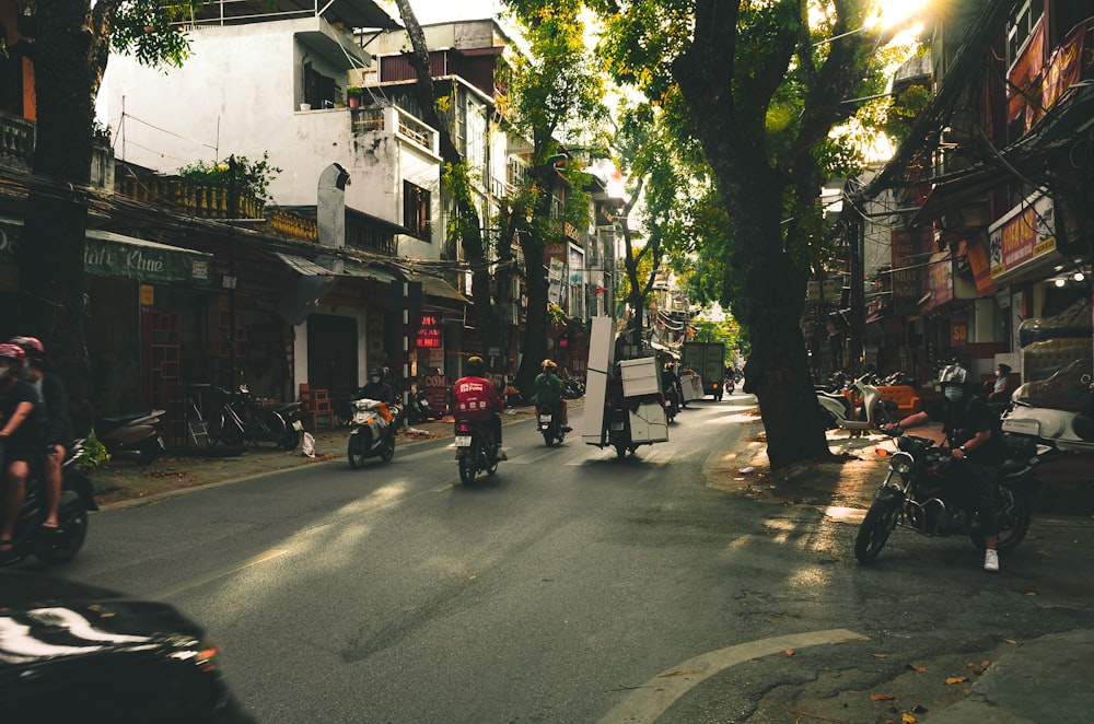 a street with motorcycles and people