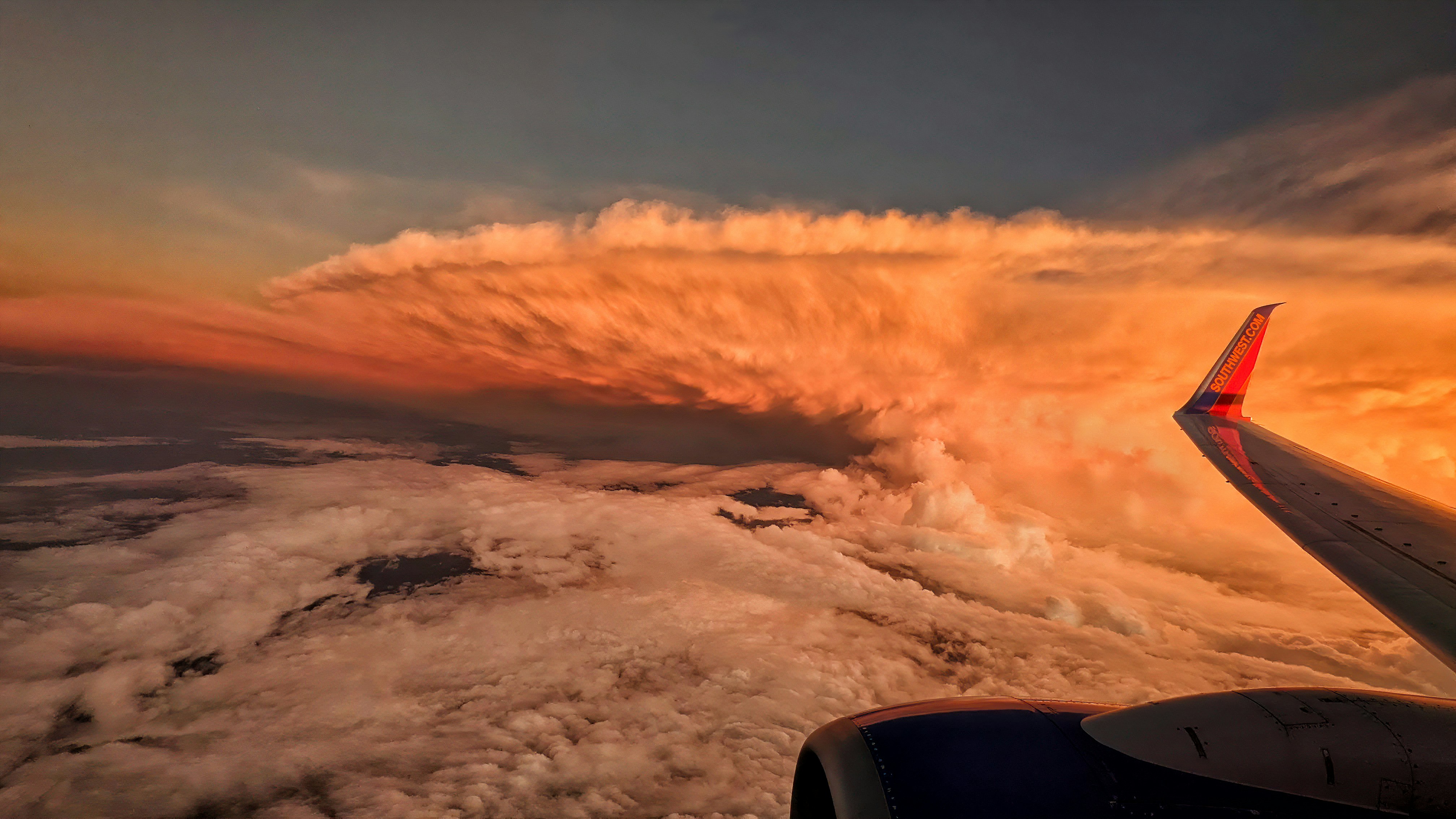 an airplane wing in the sky