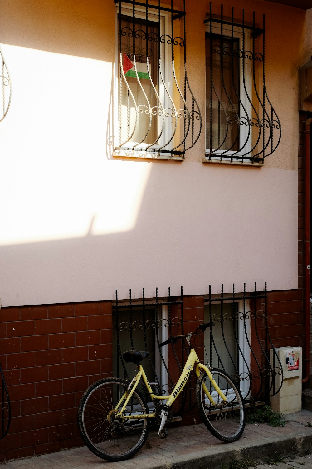 a bicycle is parked in front of a gate