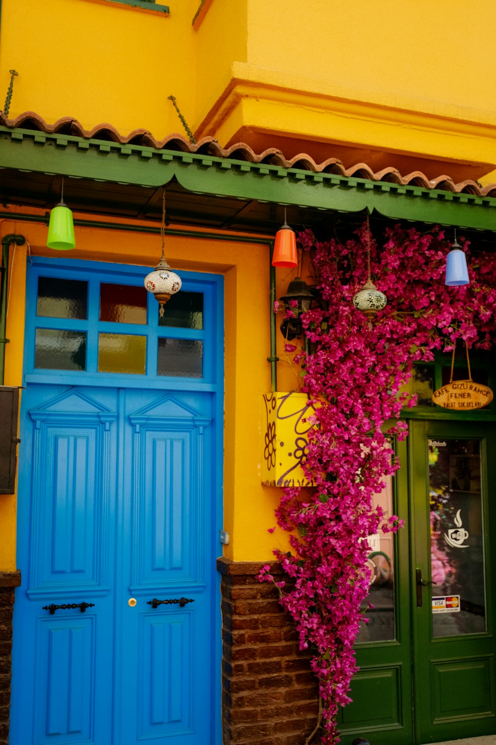 a building with blue doors and windows